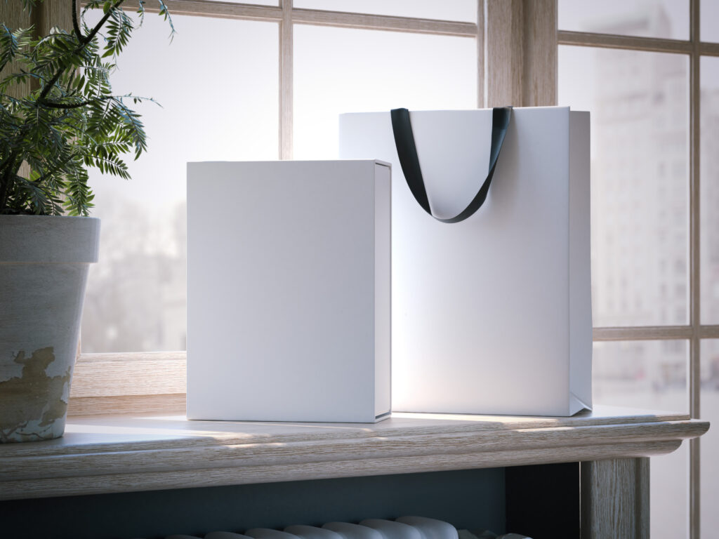 White,Box,And,Shopping,Bag,On,A,Wooden,Window,Sill.